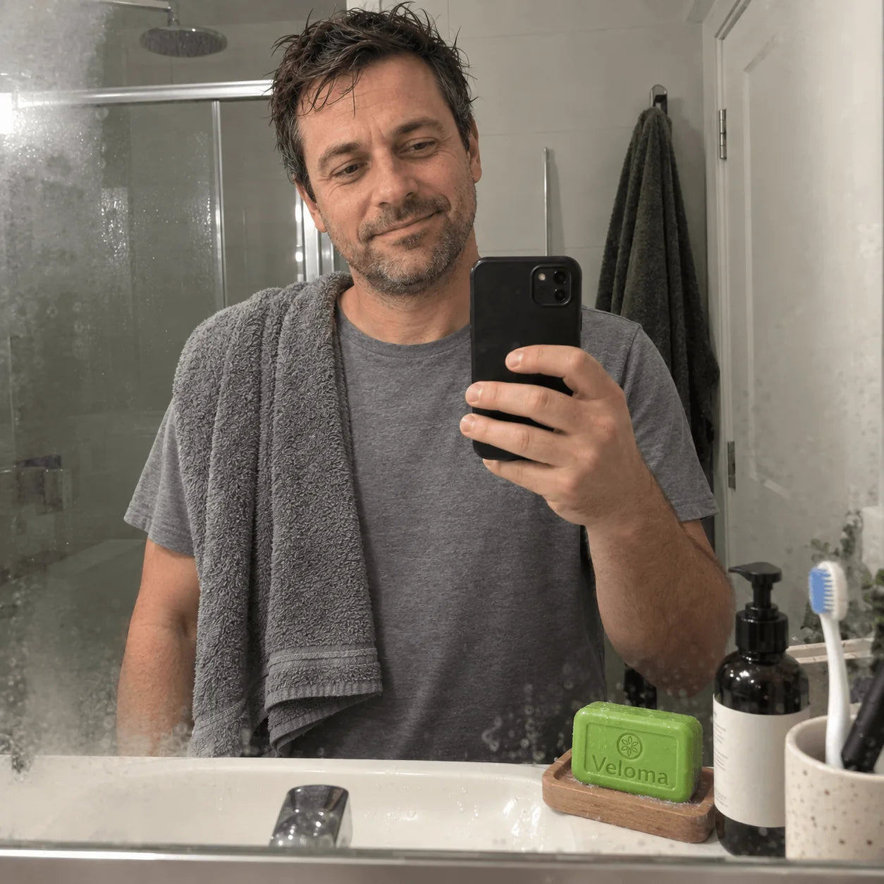Mirror selfie after a shower, the Veloma bar on the sink