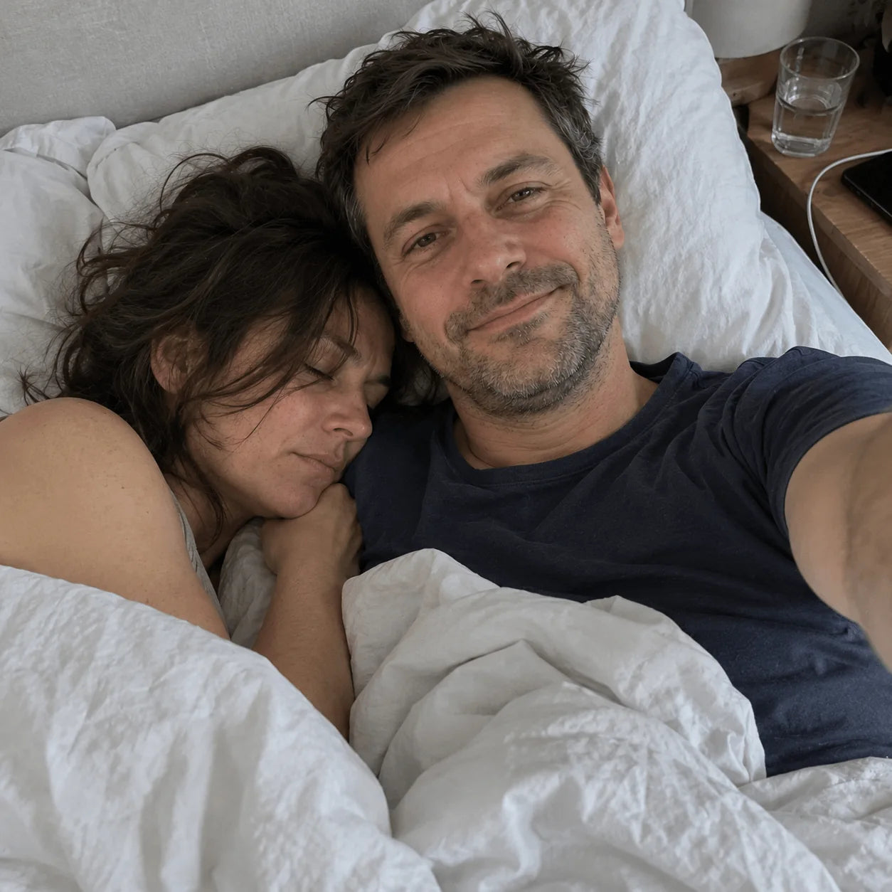 Couple in bed on a lazy morning